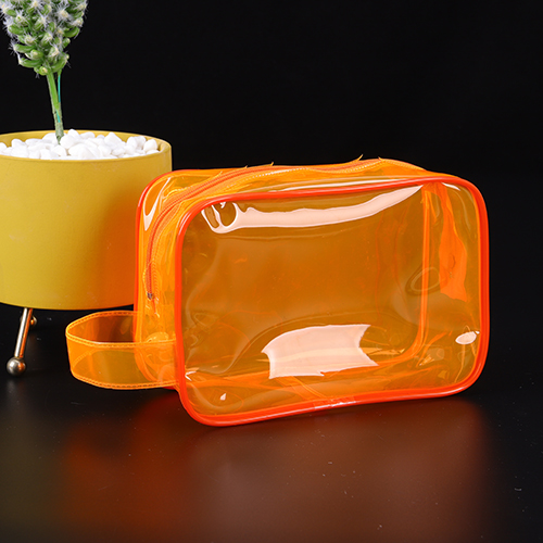 Trousse de toilette en PVC de couleur orange translucide